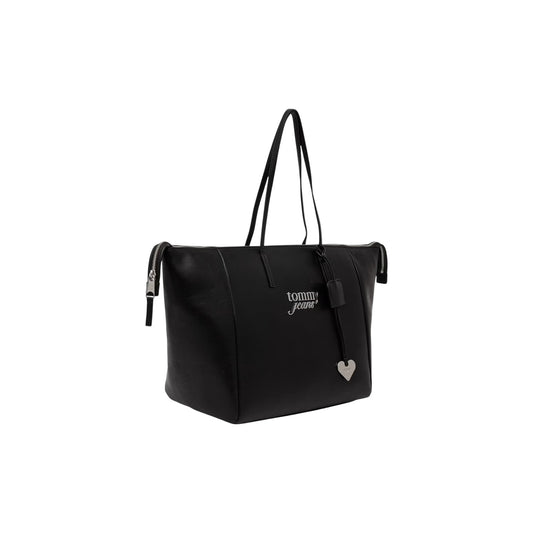 Borsa Shopper Grande Tommy Hilfiger TJW; Nero. 100% Poliuretano effetto pelle, chiusura con zip superiore, doppi manici a spalla, logo ricamato e charm a cuore metallico. Misure maxi e profonde (33,5x30x20 cm). Frontale laterale 
