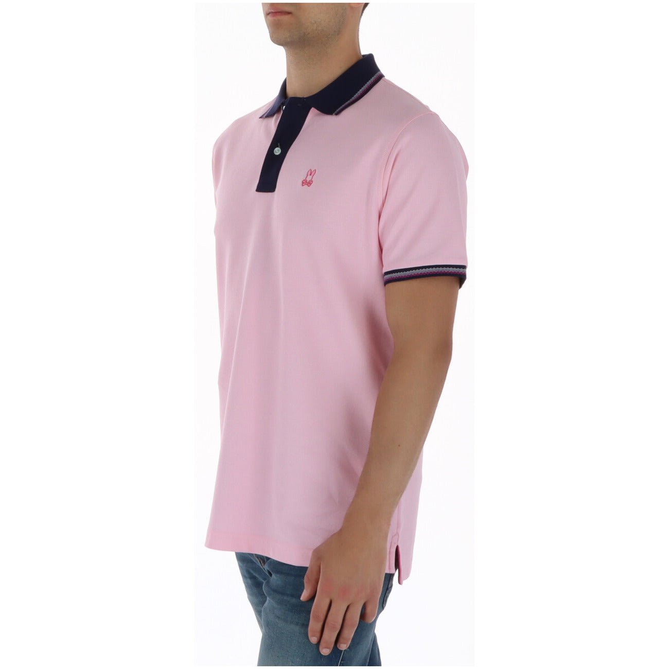 Polo Psycho Bunny Rosa; 100% Cotone Peruviano. Logo ricamato, bordature a contrasto, abbottonatura a 2 bottoni. Vestibilità regular, spacchi laterali traspiranti, stile casual-premium. Vista laterale 