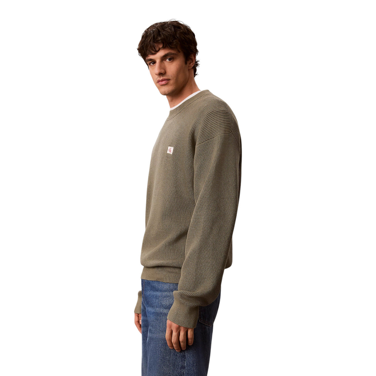 Maglione Girocollo Uomo Calvin Klein Jeans; Verde. 100% Cotone leggero lavorato a nido d'ape (waffle), vestibilità regolare e logo sul petto. Ideale per le mezze stagioni, stile casual-chic. Laterale 