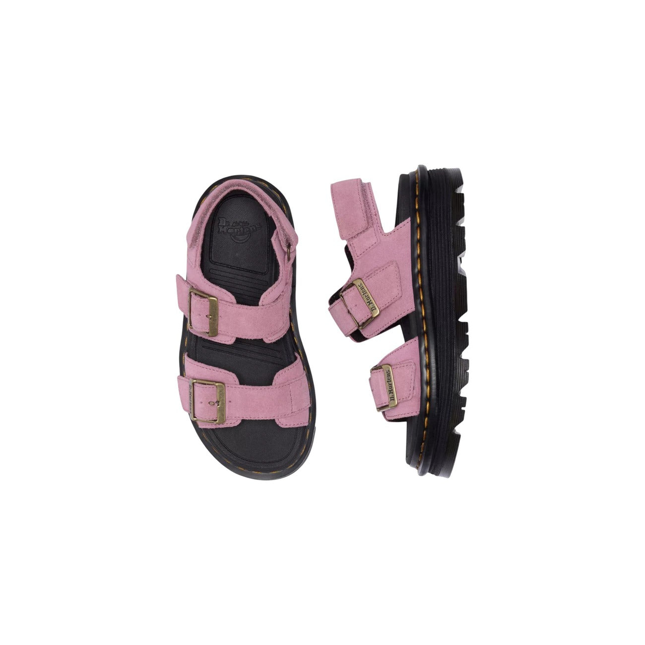 Dr. Martens Sandalo Zebzag Platform; Rosa. 100% Pelle scamosciata. Tacco 4 cm, suola ammortizzata in EVA e PVC, chiusura regolabile con fibbie e cinturino. Design robusto con cuciture gialle.