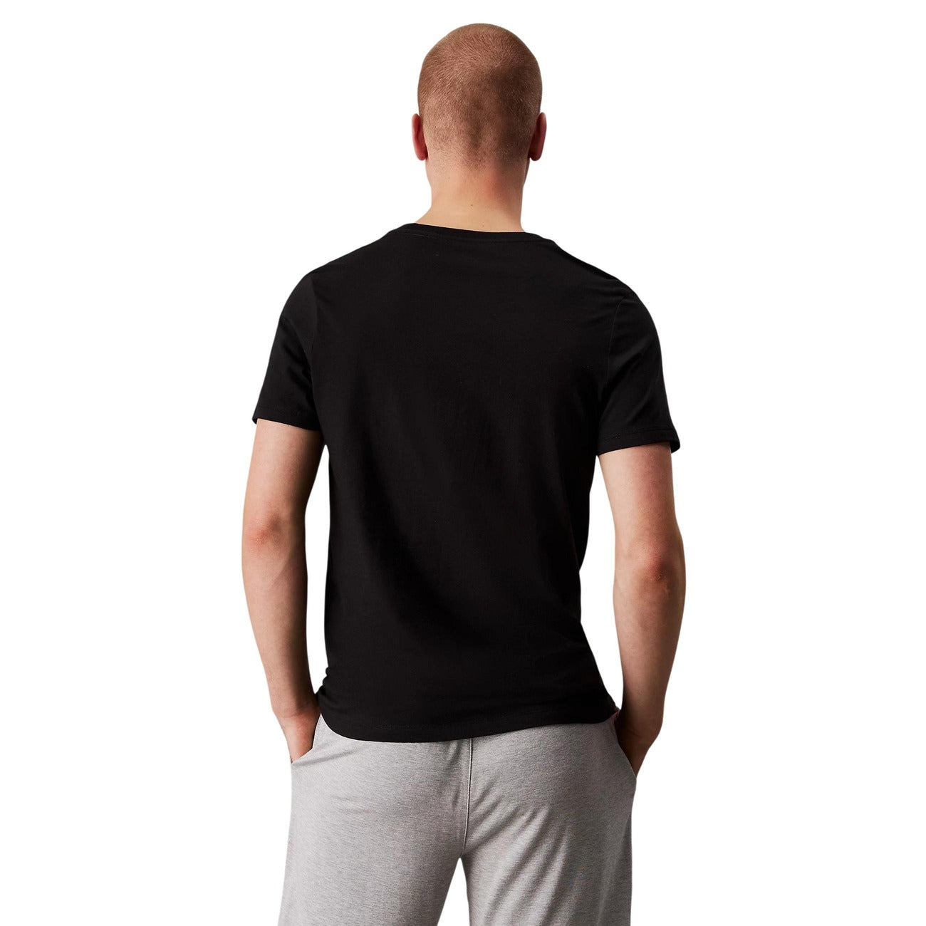 Confezione 3 T-shirt Calvin Klein in 100% cotone, vestibilità classica e girocollo; magliette intime o casual bianche con logo monogramma ricamato e design traspirante. Vista posteriore retro