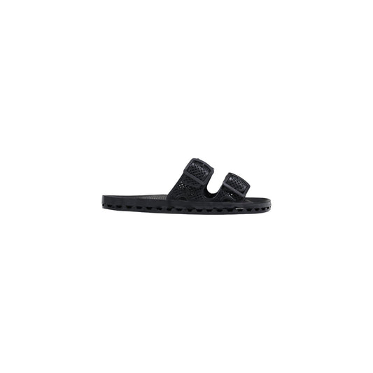 Slide Sensi La Jolla Urban Nere; 100% PVC. Doppia fascia regolabile, suola ergonomica traforata anti-ristagno, altezza 2 cm. Leggere, ultra-resistenti e lavabili. Design Made in Italy. Vista laterale 