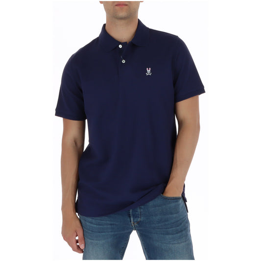 Polo Psycho Bunny Blu; 100% Cotone Pima Peruviano. Bottoni in madreperla, colletto anti-arrotolamento, logo ricamato e spacchi laterali. Tessuto piqué traspirante, qualità premium Made in Peru. Vista frontale 