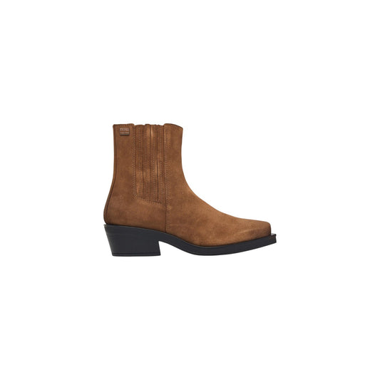 Stivaletti beige donna Tommy Jeans EN0EN03142. Stivali texani da donna in camoscio beige con punta squadrata, tacco basso 5 cm, bande elastiche e logo Tommy Jeans.