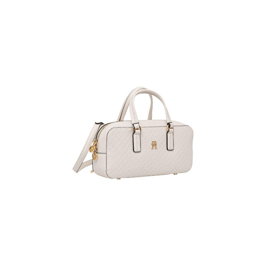 Borsa Tommy Hilfiger Monogram; Finitura in rilievo. Chiusura con zip, scomparto principale con tasca interna, tracolla removibile. Dimensioni 28x13,5 cm. Design iconico nero con dettagli dorati, ideale per ogni occasione. Colore bianco vista Frontale laterale 