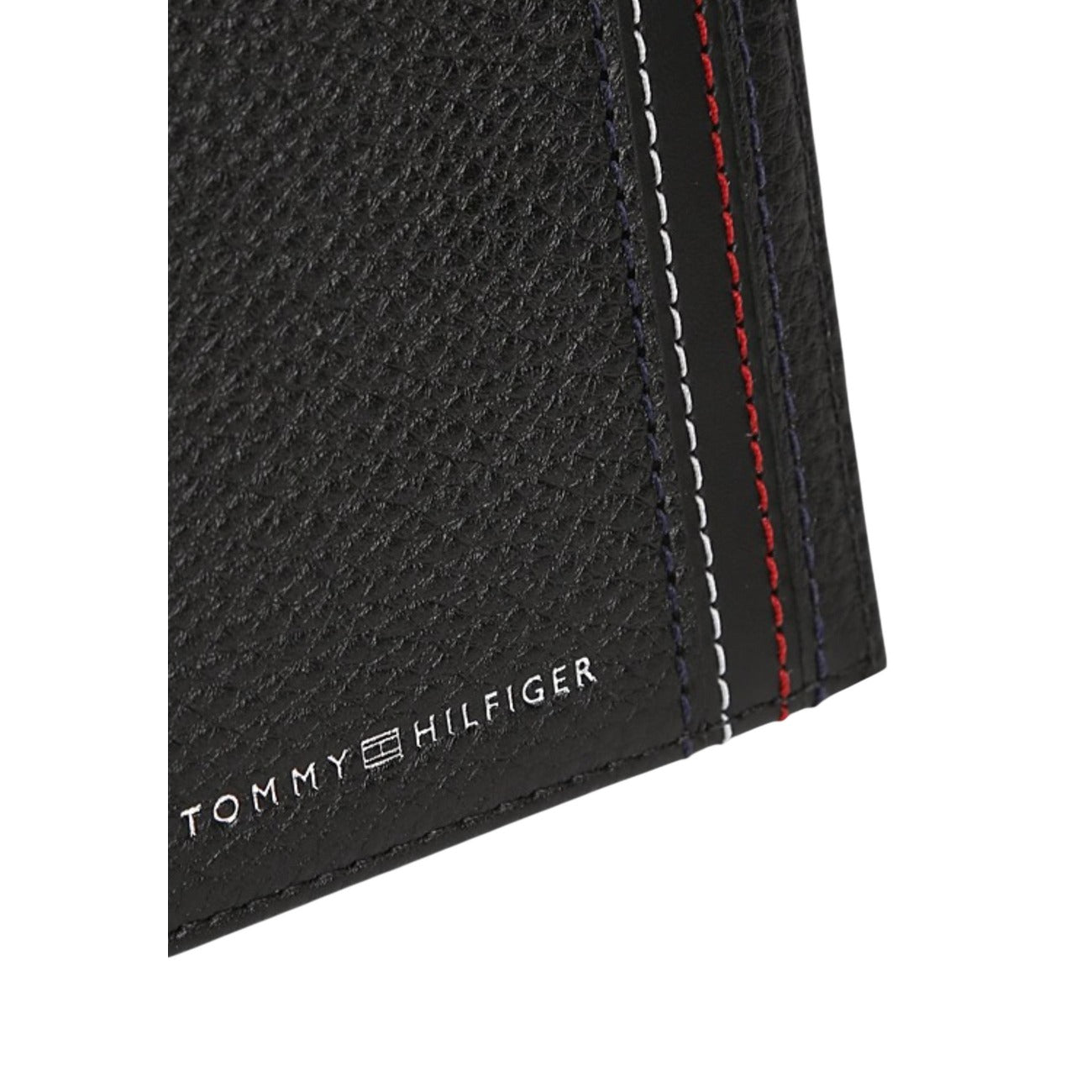 Tommy Hilfiger Central Mini CC Wallet; 100% pelle martellata, slim design, scomparti carte. L'accessorio essenziale e iconico per l'uomo moderno. Dettaglio logo 