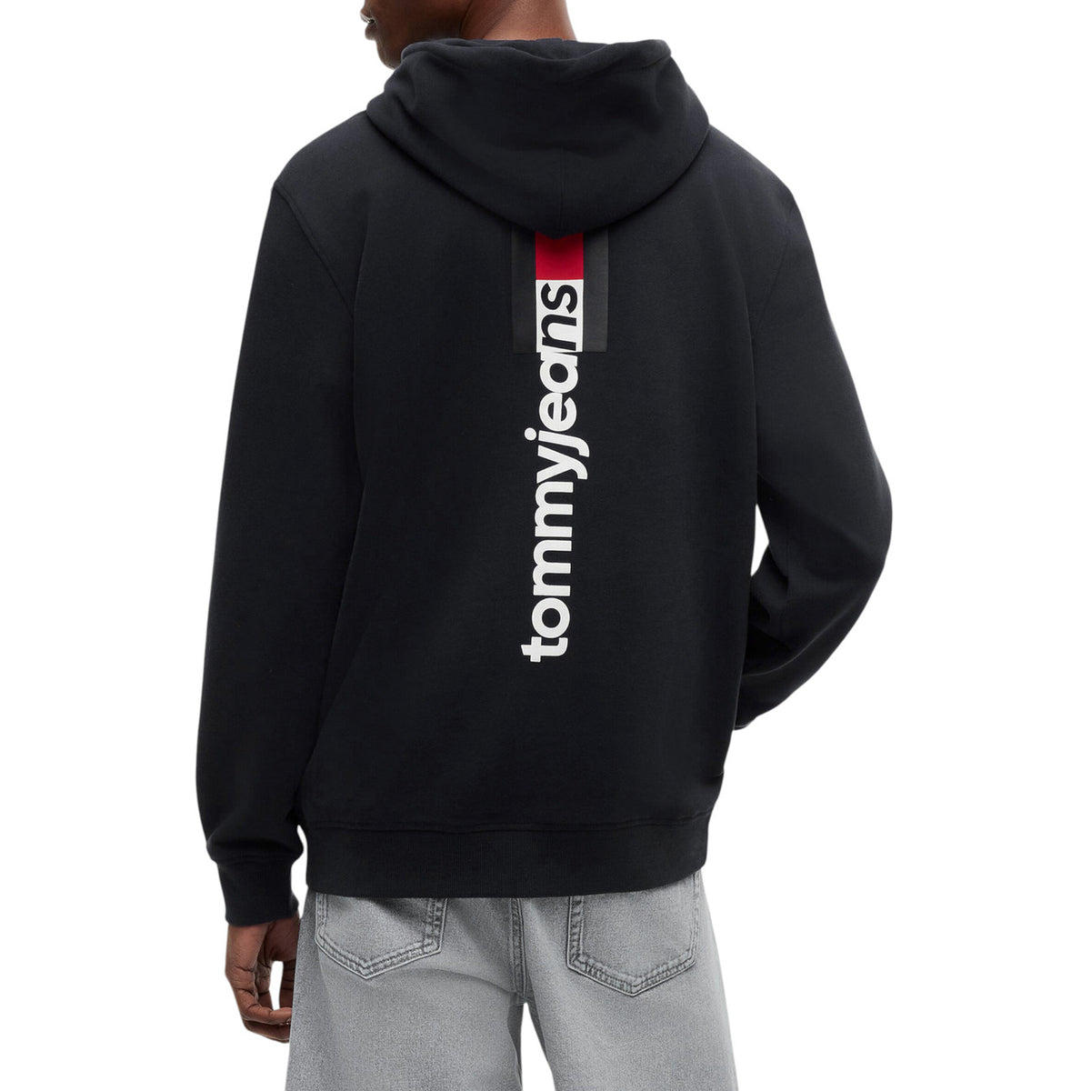 Felpa Tommy Hilfiger Jeans uomo nera con cappuccio DM0DM23393. Felpa sostenibile in cotone rigenerato con tasca a marsupio frontale, coulisse e logo Tommy Jeans sul petto, abbigliamento casual uomo mezza stagione