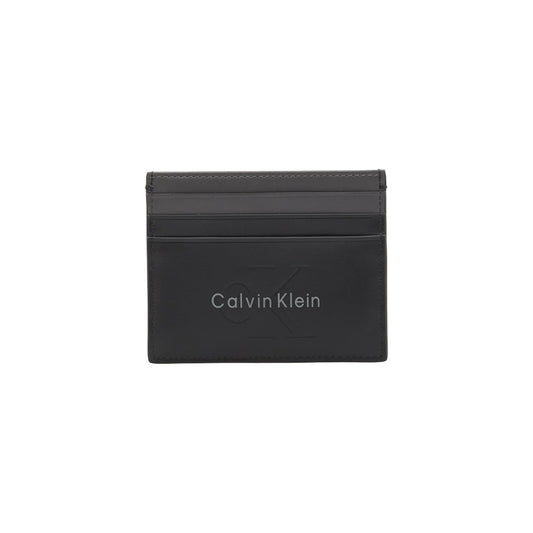 Portacarte in Pelle Calvin Klein; Nero. 100% Vera pelle, scomparti porta tessere, tasca con cerniera, logo in rilievo. Profilo ultra-slim (0,5 cm), stile minimal e funzionale 4 stagioni. Frontale 