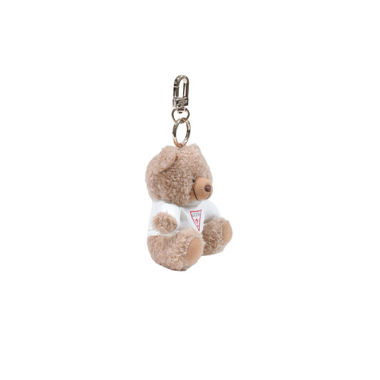 Portachiavi Donna Orsetto Marrone Guess Brooke; Charm borsa in poliestere peluche con mini t-shirt logata. Anello e moschettone in metallo dorato, stile casual e perfetto come idea regalo. Laterale 