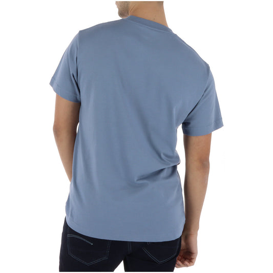 Vans T-shirt RA1FOI1 Azzurra; 100% cotone, stampa frontale, maniche corte. Il classico street-style fresco e resistente. Vista posteriore 