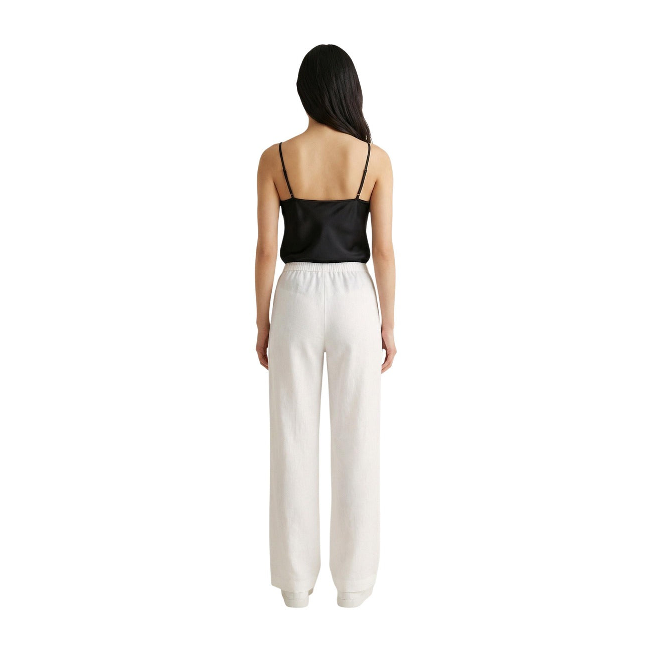 Pantaloni Wide Leg Bianchi Only; Effetto Lino. Vita elastica con coulisse, tessuto leggero in viscosa, vestibilità ampia. Freschezza e stile minimalista per l'estate. Vista posteriore figura intera 
