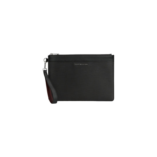 Pochette nera uomo Tommy Hilfiger TH Business Saffiano AM0AM14823. Pouch a mano e beauty case da viaggio da uomo in trama saffiano nera con zip e placchetta logo Tommy Hilfiger.