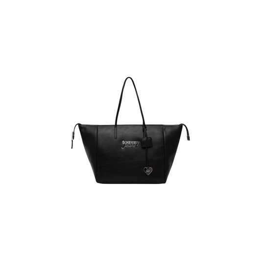 Borsa Shopper Grande Tommy Hilfiger TJW; Nero. 100% Poliuretano effetto pelle, chiusura con zip superiore, doppi manici a spalla, logo ricamato e charm a cuore metallico. Misure maxi e profonde (33,5x30x20 cm). Vista frontale 