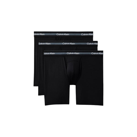 Boxer Lunghi Uomo Neri Calvin Klein 3-Pack; Confezione tripla di boxer brief long in poliestere riciclato e lycra. Vita regolare con fascia elastica logata, stile activewear e casual-luxury 4 stagioni.